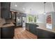 Contemporary kitchen with granite countertops, stainless steel appliances, and ample natural light at 2548 Kickerillo Se Way, Atlanta, GA 30316