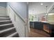 Partial view of a modern kitchen featuring an island with sleek grey flooring and appliances at 2548 Kickerillo Se Way, Atlanta, GA 30316