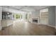 Spacious living area featuring modern flooring, a cozy fireplace, and built-in shelving for stylish storage and decor at 2548 Kickerillo Se Way, Atlanta, GA 30316