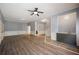 Spacious living room features hardwood floors, a staircase and wet bar at 2548 Kickerillo Se Way, Atlanta, GA 30316