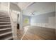 Open-concept living room with hardwood floors, staircase and a bar area at 2548 Kickerillo Se Way, Atlanta, GA 30316