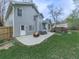 Home backyard featuring a fire pit, patio, and well-manicured lawn, perfect for outdoor entertaining at 3623 Spring Meadow Ct, Acworth, GA 30101
