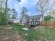 Large backyard featuring a deck, patio, and privacy fence at 3623 Spring Meadow Ct, Acworth, GA 30101