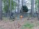 Outdoor area with a fire pit in a wooded backyard at 3623 Spring Meadow Ct, Acworth, GA 30101