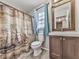 Bathroom with vanity, decorative shower curtain, and a window for natural light at 3623 Spring Meadow Ct, Acworth, GA 30101