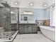 Luxurious bathroom with double vanity, soaking tub, and glass-enclosed shower with rainfall shower head at 3623 Spring Meadow Ct, Acworth, GA 30101