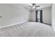 Large bedroom with neutral walls, ceiling fan, and soft carpeting, creating a serene atmosphere at 3623 Spring Meadow Ct, Acworth, GA 30101