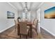 Elegant dining room with hardwood floors, modern lighting, and stylish decor at 3623 Spring Meadow Ct, Acworth, GA 30101