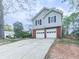 Two-story home with an attached garage, set on a spacious lot with a well-manicured lawn at 3623 Spring Meadow Ct, Acworth, GA 30101
