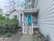 Charming home entrance with a bright blue door and well-maintained landscaping at 3623 Spring Meadow Ct, Acworth, GA 30101