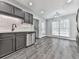 Kitchen and dining area with stainless steel dishwasher and adjacent breakfast nook at 3623 Spring Meadow Ct, Acworth, GA 30101