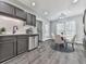 Kitchen and dining area with stainless steel dishwasher and adjacent breakfast nook at 3623 Spring Meadow Ct, Acworth, GA 30101
