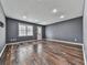 Spacious living room with hardwood floors, recessed lighting, a window, and a door at 3623 Spring Meadow Ct, Acworth, GA 30101
