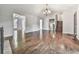 Spacious living room featuring hardwood floors, a fireplace, and a staircase at 3623 Spring Meadow Ct, Acworth, GA 30101