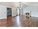 Large living room featuring a fireplace, hardwood floors, and natural light at 3623 Spring Meadow Ct, Acworth, GA 30101