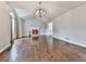 Bright living room featuring a fireplace, high ceilings, and hardwood floors at 3623 Spring Meadow Ct, Acworth, GA 30101
