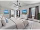 Main bedroom with vaulted ceiling, ensuite bathroom, large bed, and mounted televisions at 3623 Spring Meadow Ct, Acworth, GA 30101