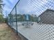 Community pool area featuring tables, chairs, and umbrellas, perfect for relaxing and enjoying the outdoors at 3623 Spring Meadow Ct, Acworth, GA 30101