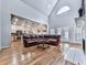 Expansive living room boasts vaulted ceilings, fireplace, and abundant natural light at 5090 Eubanks Rd, Woodstock, GA 30188