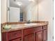 Bathroom featuring a sink, vanity, mirror, and white cabinets at 108 Telfair Ln, Mcdonough, GA 30253