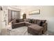 Comfortable living room featuring a large sectional sofa and patterned rug at 108 Telfair Ln, Mcdonough, GA 30253