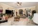 Bright and spacious living room with plush seating, neutral colors, and multiple archways at 108 Telfair Ln, Mcdonough, GA 30253