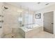 Modern bathroom with glass shower and corner soaking tub, with marble tile and flooring at 2652 Brickell Sq, Atlanta, GA 30341