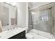 Modern bathroom with a marble vanity, a combination shower and tub, and neutral tones at 2652 Brickell Sq, Atlanta, GA 30341