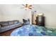 Bedroom with vaulted ceiling featuring a comfortable sofa and a well-lit desk area at 2652 Brickell Sq, Atlanta, GA 30341