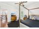 Cozy bedroom features a modern four poster bed, hardwood floors, natural light, and fresh decor at 2652 Brickell Sq, Atlanta, GA 30341