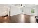 Spacious bedroom with beautiful hardwood floors, a ceiling fan, and natural light from two windows at 2652 Brickell Sq, Atlanta, GA 30341