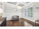 Elegant dining room featuring wainscoting, coffered ceiling, and ample natural light from the large window at 2652 Brickell Sq, Atlanta, GA 30341