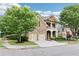 Charming two-story brick and stone home featuring a two-car garage and manicured landscaping at 2652 Brickell Sq, Atlanta, GA 30341