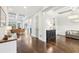 Open foyer with hardwood floors, coffered ceiling accents, and seamless transition to the living and dining areas at 2652 Brickell Sq, Atlanta, GA 30341