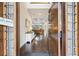 Inviting foyer with gleaming hardwood floors and a view of the coffered ceiling in the living room at 2652 Brickell Sq, Atlanta, GA 30341