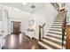 Spacious foyer with hardwood floors, staircase, and detailed trim, offering a grand entrance to the home at 2652 Brickell Sq, Atlanta, GA 30341