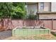 Backyard garden plot with a wood fence and cinder block raised bed at 2652 Brickell Sq, Atlanta, GA 30341
