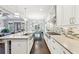 Gourmet kitchen with an island and stainless steel appliances open to the bright living area at 2652 Brickell Sq, Atlanta, GA 30341