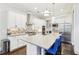 Modern kitchen with white cabinetry, stainless steel appliances, and center island with seating at 2652 Brickell Sq, Atlanta, GA 30341
