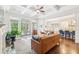 Bright living room with coffered ceilings, hardwood floors, and access to outdoor patio at 2652 Brickell Sq, Atlanta, GA 30341