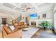 Cozy living room with a fireplace, coffered ceiling, hardwood floors, and a comfortable seating arrangement at 2652 Brickell Sq, Atlanta, GA 30341