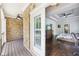 Partial view of the main bedroom from a brick patio with an exterior ceiling fan and a sliding glass door at 2652 Brickell Sq, Atlanta, GA 30341