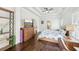 Comfortable main bedroom with hardwood floors, a dresser, and a tray ceiling with a ceiling fan at 2652 Brickell Sq, Atlanta, GA 30341
