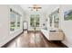 Cozy sunroom with large windows, neutral tones, and a peaceful backyard view at 2652 Brickell Sq, Atlanta, GA 30341