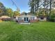 Large backyard with a patio perfect for outdoor entertaining and relaxation at 661 Oak Dr, Riverdale, GA 30274
