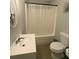 Neat bathroom features a shower with a tub, a modern sink, and updated fixtures at 661 Oak Dr, Riverdale, GA 30274
