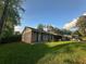 Charming brick home with lush landscaping and a well-manicured lawn at 661 Oak Dr, Riverdale, GA 30274