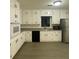 Updated kitchen featuring white cabinets, stainless steel appliances, and sleek countertops at 661 Oak Dr, Riverdale, GA 30274