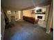 Large living room combining carpet and tile with a fireplace at 661 Oak Dr, Riverdale, GA 30274