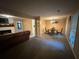 Open living space combining carpet and tile into the dining room and fireplace at 661 Oak Dr, Riverdale, GA 30274